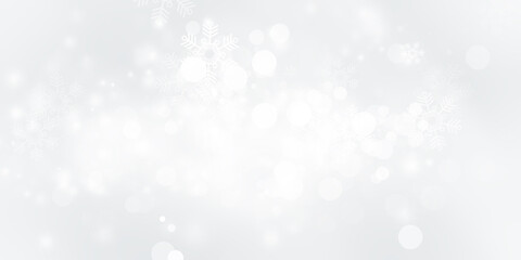 white and gray snow blur abstract background. Snowflake Bokeh Christmas blurred beautiful shiny Christmas lights.