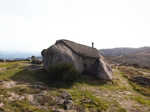 Casa do Penedo House museum built between two stone rocks boulders architectural monument near Fafe in Northern Portugal
