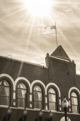 Flag flying high on building
