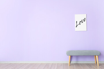 Cozy bench and picture near color wall in room