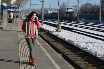 woman listen the phone on the platform of sal