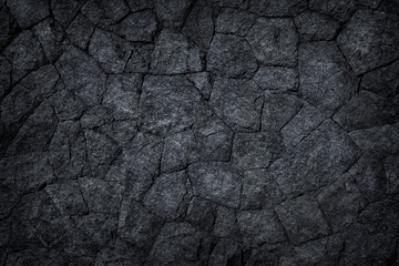 Black slate sotne wall or Dark stone texture abstract background