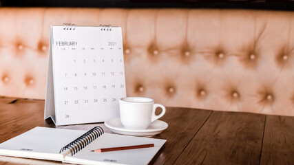 Close up the calendar on the brown table in planning ideas.