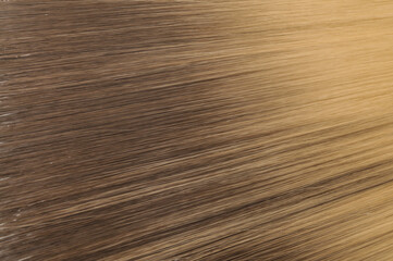 close up texture of single piece clip in straight black  blended to blonde two tone ombre style...