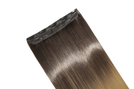 close up texture of single piece clip in straight black  blended to blonde two tone ombre style synthetic  hair extensions