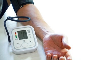 Monitoring blood pressure of patients using upper arm blood pressure monitor in the clinic...
