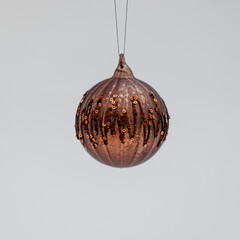 Bronze Christmas tree ball covered with zigzag ornaments and tiny beads