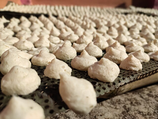 Bori is a form of dried lentil dumplings popular in Bengali cuisine. It is made from a paste of urad dal and winter melon which is sun-dried for 3–5 days.