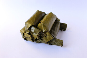 rice cake wrapped leaves, traditional food with isolated background