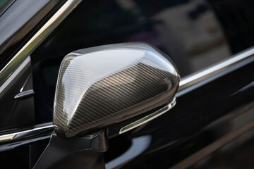 Close up of car side mirror from the carbon fibre