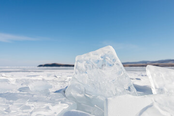 Fototapeta na wymiar Close up of clean ice sheet at the Baikal lake in the winter season in Russia