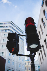 looking up at red traffic light