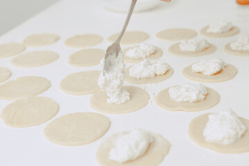 The process of making cookies. A man cooks in the kitchen. Modern lifestyle in home.