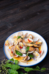Stir fried Spicy Clam (Surf clam, Short necked clam, Carpet clam, Venus shell, Baby clam) with Thai Holy Basil