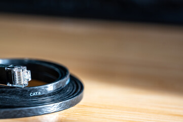 Selective focus on Category 6 cable or Cat 6 ethernet flat cable used for transferring high speed...