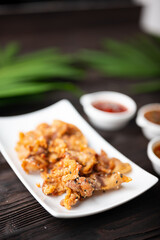 Crispy fried sliced belly pork with spicy sauce