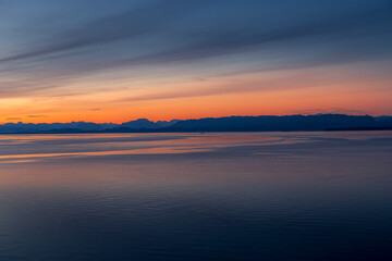 Fototapeta na wymiar Ferry crossing at sunset travel or tourism image- British Columbia, Canada