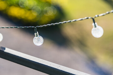 Fototapeta premium Decorative light bulbs outdoors. Party and illumination concept