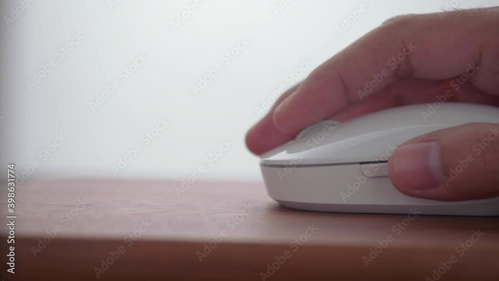 Aufkleber click white computer mouse on a work desk in dolly shot. working with a pc or laptop. close-up foota