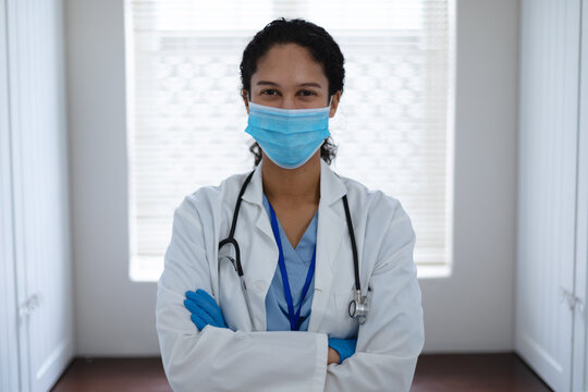 Portrait of mixed race female doctor looking at camera