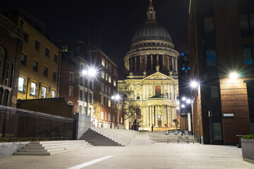 St. Paul's cathedral at night viewed from Sermon Lane in London. England