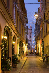 Naklejka na ściany i meble View on lanes with Christmas illumination in night Parma of Italy outdoors.