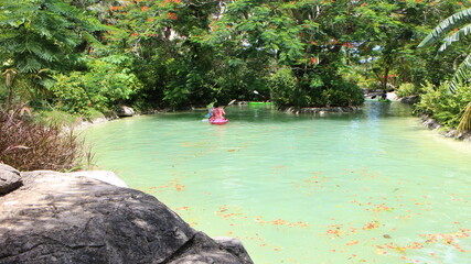 a person in the pool with flowers