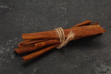 Aroma cinnamon sticks over dark