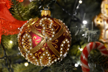 round glass ornament hanging on the Christmas tree