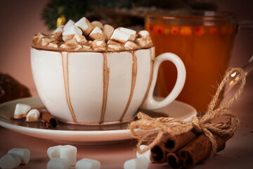 Marshmallows in an overflowing mug with coffee close up - 398642940