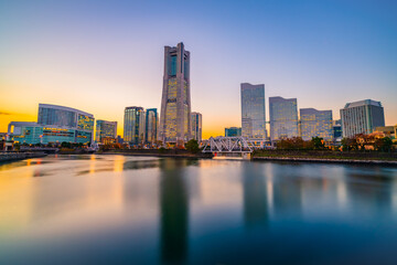 Fototapeta na wymiar Yokohama city skyline at sunset viewed from the bay