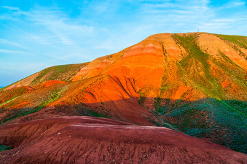 Big Bogdo mountain. Red sandstone outcrops on the slopes sacred mountain in Caspian steppe Bogdo -...