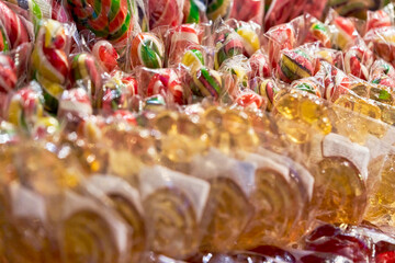 Background of multicolored sweet lollipops, close up