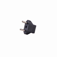 2-pin EU to US plug type Converter black Plastic element isolated on a white background. Close up