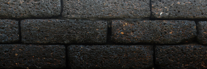 Black and grey bricks old wall. Abstract background. Backdrop wallpaper and Texture concrete grunge for building.
