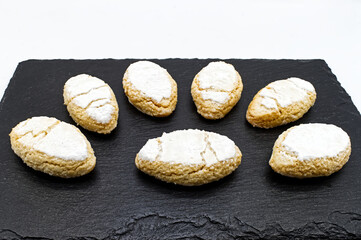 
Ricciarelli, almond cookies originating from Siena, Tuscany, Italy. Ricciarelli senesi are traditional Christmas marzipan cookies, made with almonds, sugar, egg whites.
