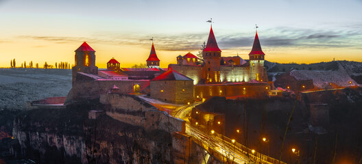 Naklejka premium Kamianets-Podilskyi fortress on a winter night