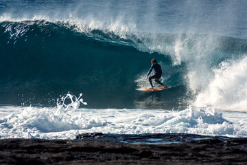 Surfer gets tubed