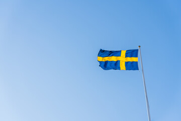 Swedish flag isolated on blue sky