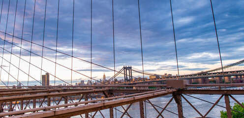 Brooklyn Bridge at sunset with Manhattan skyline