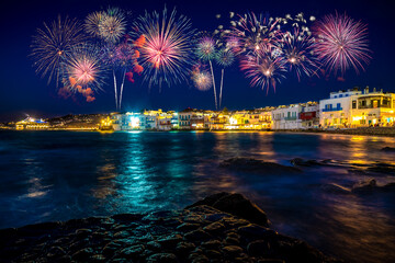 Fireworks display at Little Venice district of Mykonos island at night. Greece - obrazy, fototapety, plakaty