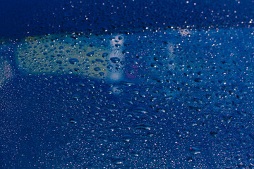 Water rain drops blue Vintage on glass wall on car rain drops on clear window or rain droplets on glass Of Raindrops Or Vapor Trough Window Glass Water droplets blue and Rain droplets
