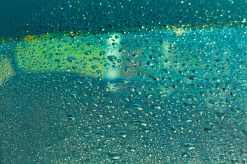 Water rain drops blue Vintage on glass wall on car rain drops on clear window or rain droplets on glass Of Raindrops Or Vapor Trough Window Glass Water droplets blue and Rain droplets
