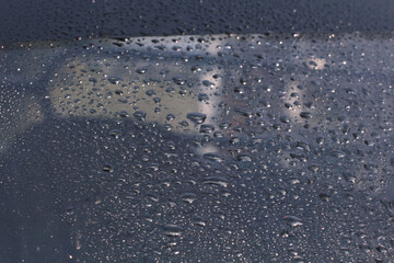 Water rain drops blue Vintage on glass wall on car rain drops on clear window or rain droplets on glass Of Raindrops Or Vapor Trough Window Glass Water droplets blue and Rain droplets
