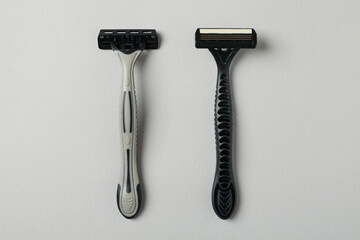Male razors on gray background, space for text