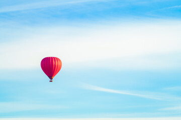 Fototapeta na wymiar Hot red air balloon on blue sky