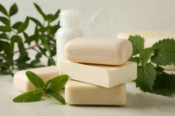 Concept of personal hygiene with natural soap on beige table