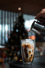 Fototapeta na wymiar iced coffee latte on christmas holidays display background 