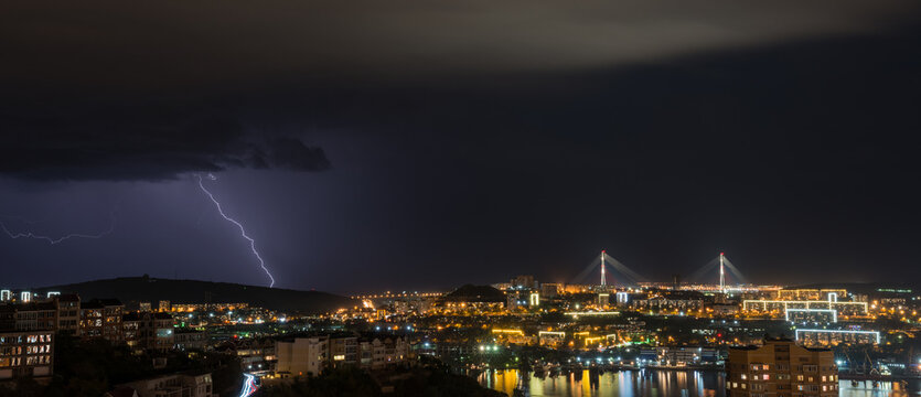 Lightning storm over night city.