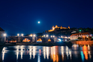 Fototapeta na wymiar Evening view of Wurzburg in Bavaria, Germany, view of the Marienberg Fortress and old bridge at the Main River 